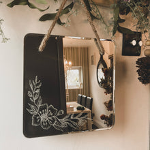 Load image into Gallery viewer, Charming handmade floral mirror, hand-engraved with intricate designs, crafted with care to illuminate your space and bring warmth and cheer into any room