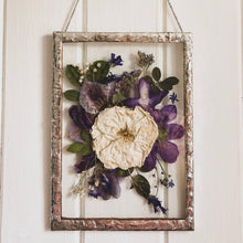 Load image into Gallery viewer, Bespoke handmade pressed flower frame featuring personally picked and arranged purple and white flowers, set in a hand-soldered silver frame, perfect for celebrating special moments and adding elegance to any home