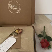 Load image into Gallery viewer, Eco-friendly gift wrap made from recycled materials, adorned with a botanical print, promoting sustainable gifting.