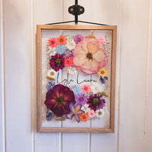 Load image into Gallery viewer, Handcrafted pressed flower frame featuring a vibrant pink hues, perfect for home decor.
