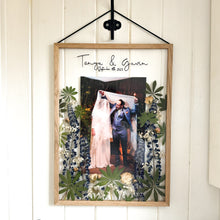 Load image into Gallery viewer, Handcrafted pressed flower frame featuring a couple&#39;s wedding photo, vibrant lupins and pink roses, perfect for home decor.
